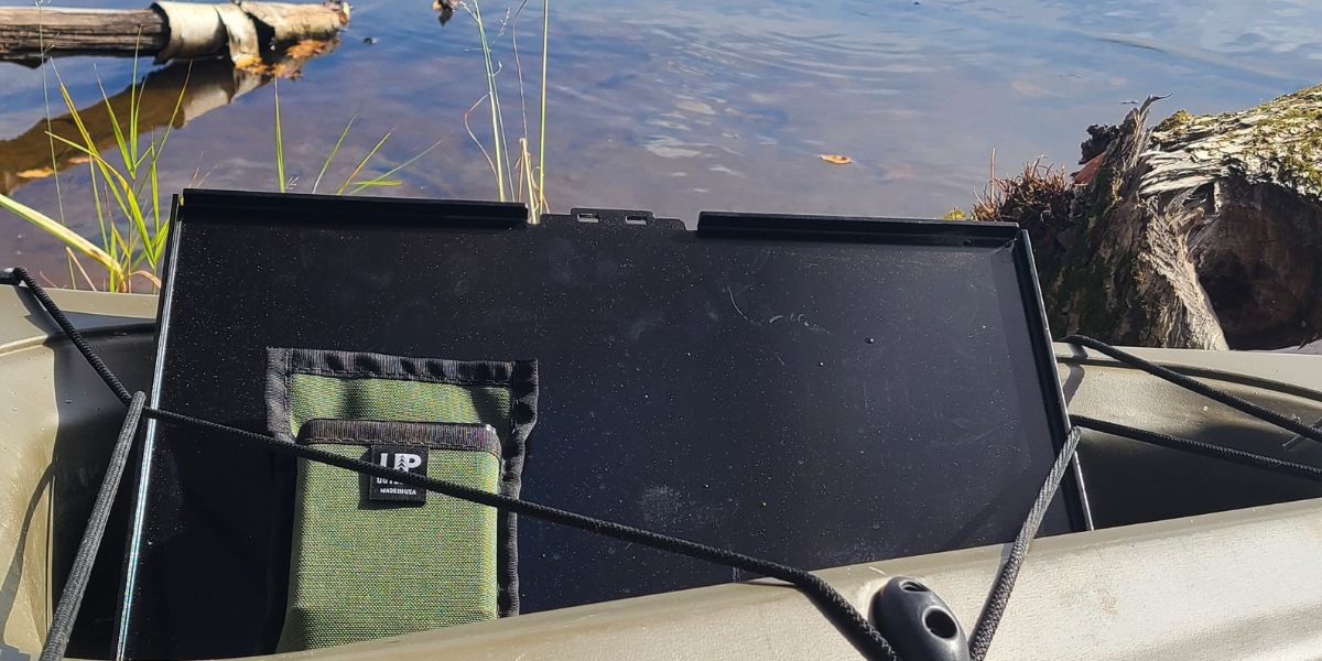 Top Shelf camp and outdoor table being stored in a kayak.